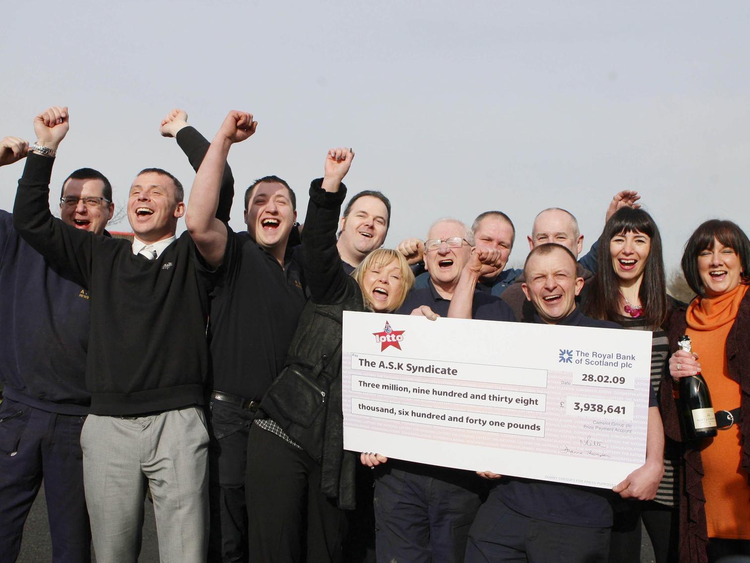 Members of staff from A.S.K. Rewinds Ltd in Accrington celebrate winning 3,938,641 in March 2009