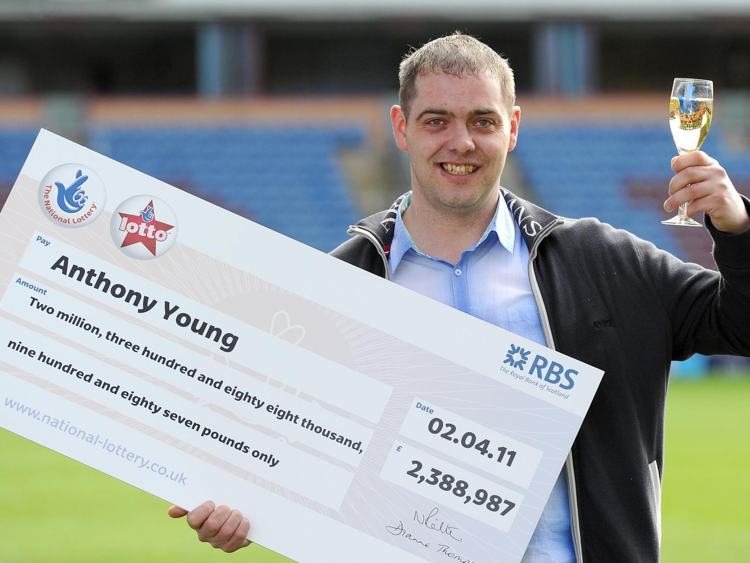 Burnley FC fan Anthony Young celebrates his 2.38 million lottery win at Turf Moor in April 2011