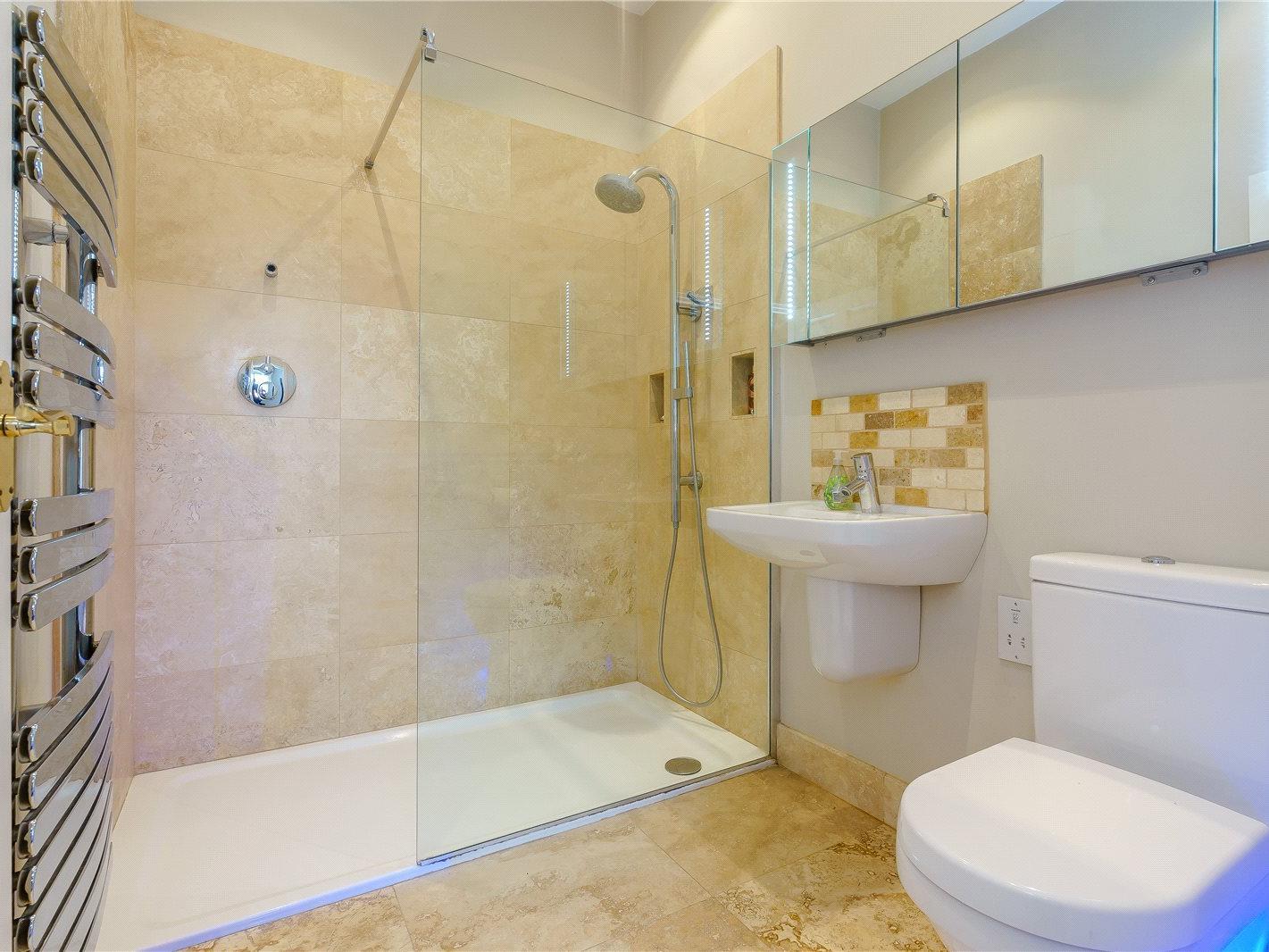 The bathrooms feature huge showers and heated towel racks.