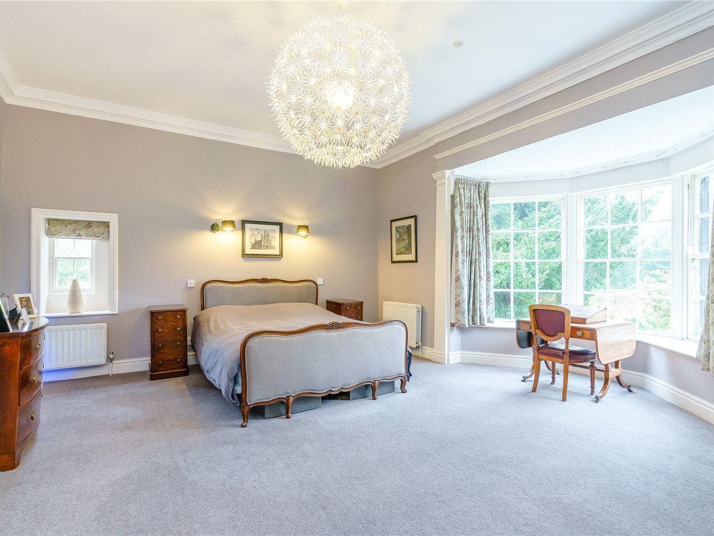 The large master bedroom has an  fireplace, large bay window and dressing room fitted with a walk in wardrobe.