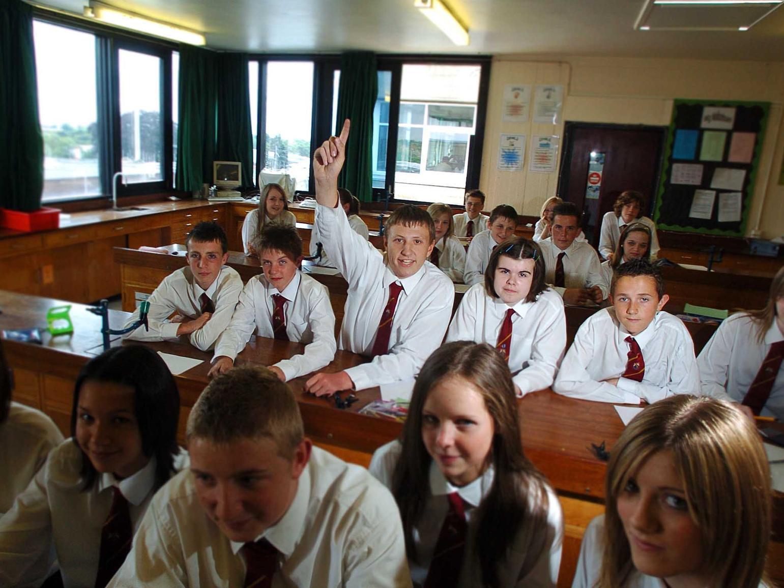 Garforth Community College received an excellent Ofsted report. Pictured (centre) Ben Taylor 14 enjoys the science class.
