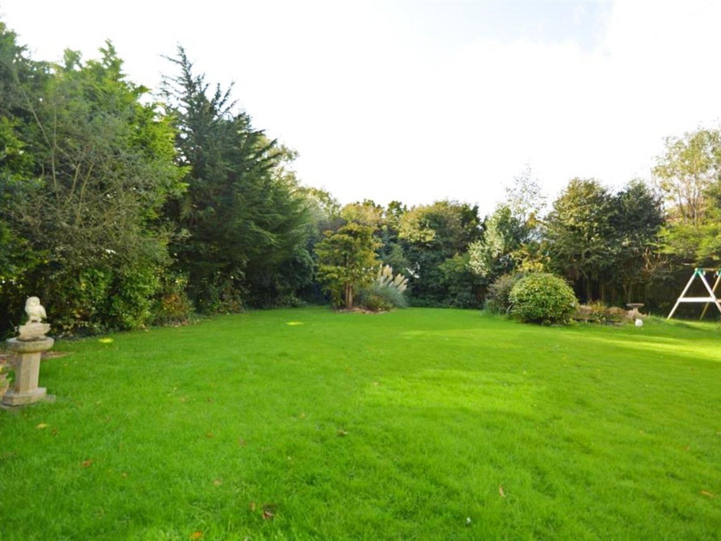 The garden is mainly laid to lawn with well established borders.