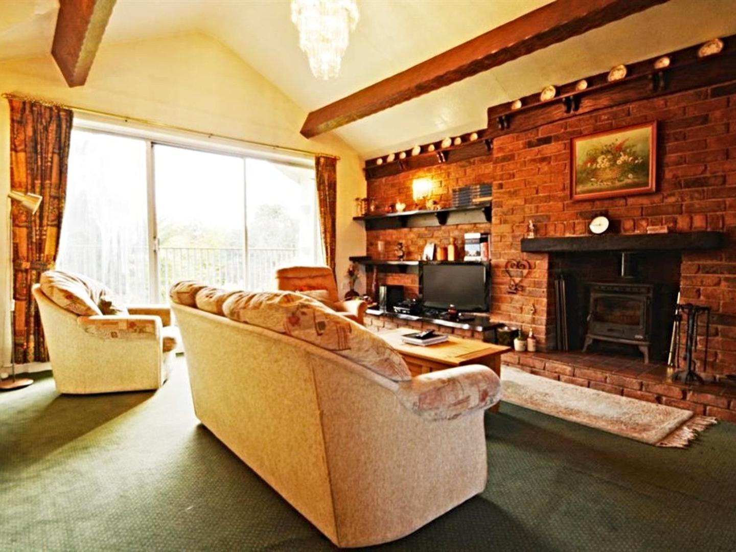 It comprises entrance hallway; lounge with multi-fuel stove set into the chimney breast.