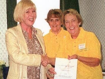 Entertainer Hilary ONeil presents a certificate marking a 5,000 award to the Poulton Friends of Trinity Hospice from the National Lottery, Millennium Festival Awards for All Scheme to Beryl Moran (secretary) and Doreen Southern (chair)