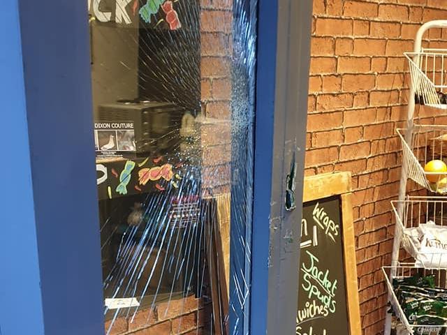 The suspects smashed the door. Photos provided by owners of the business.