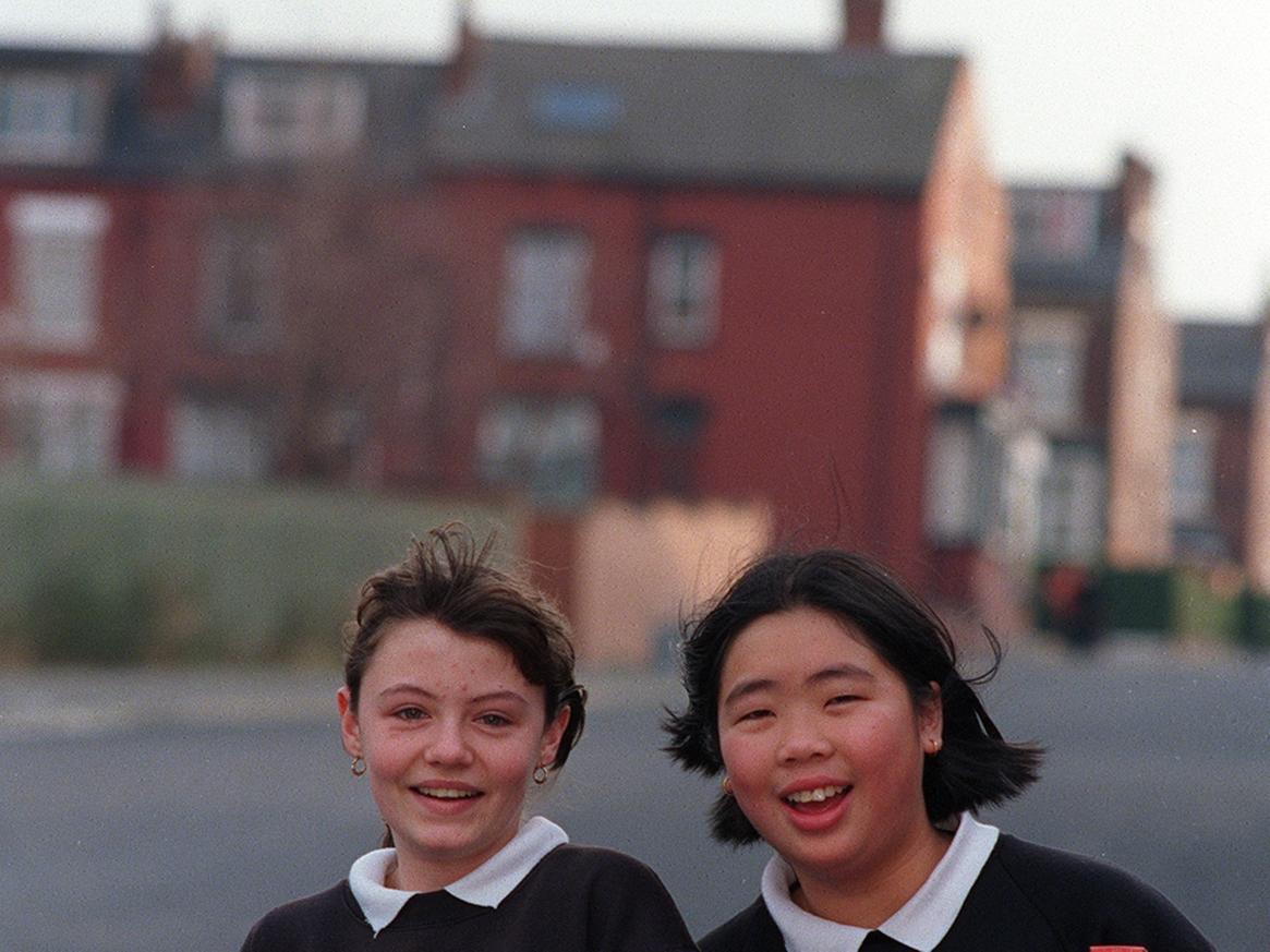 Matthew Murray pupils Louise Vause (left) and Emmie Wai leave school with Christmas food parcels for pensioners in Holbeck.