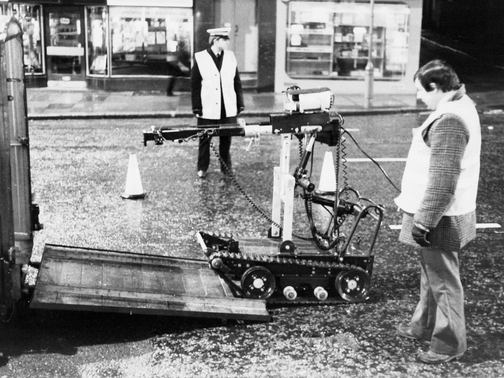Goliath, the army's robot device, is put back in its trailer after a bomb scare on Vicar Lane. Pictured in February 1977.