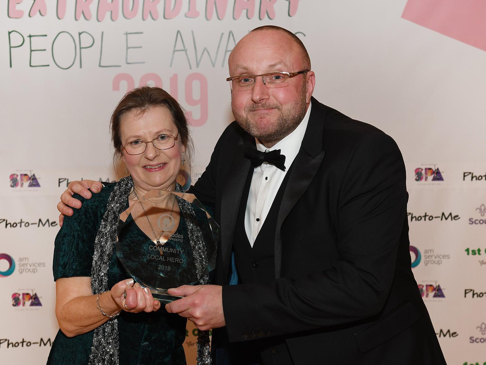 Susan Papworth collects Douglas Papworth's Community Local Hero award.