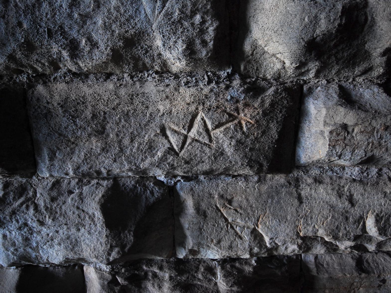 The symbols and marks on the walls are intriguing.