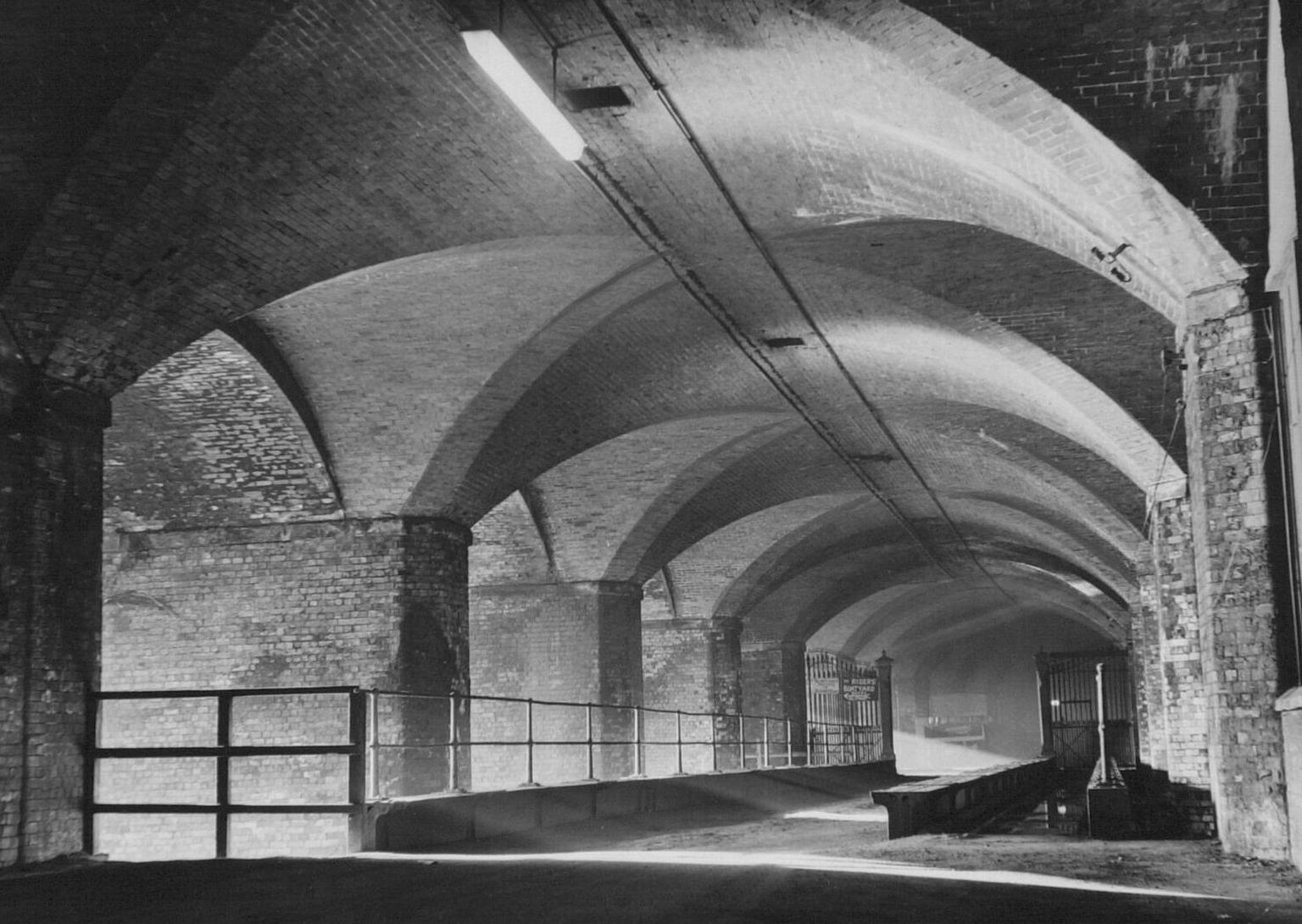 Go inside the Dark Arches.