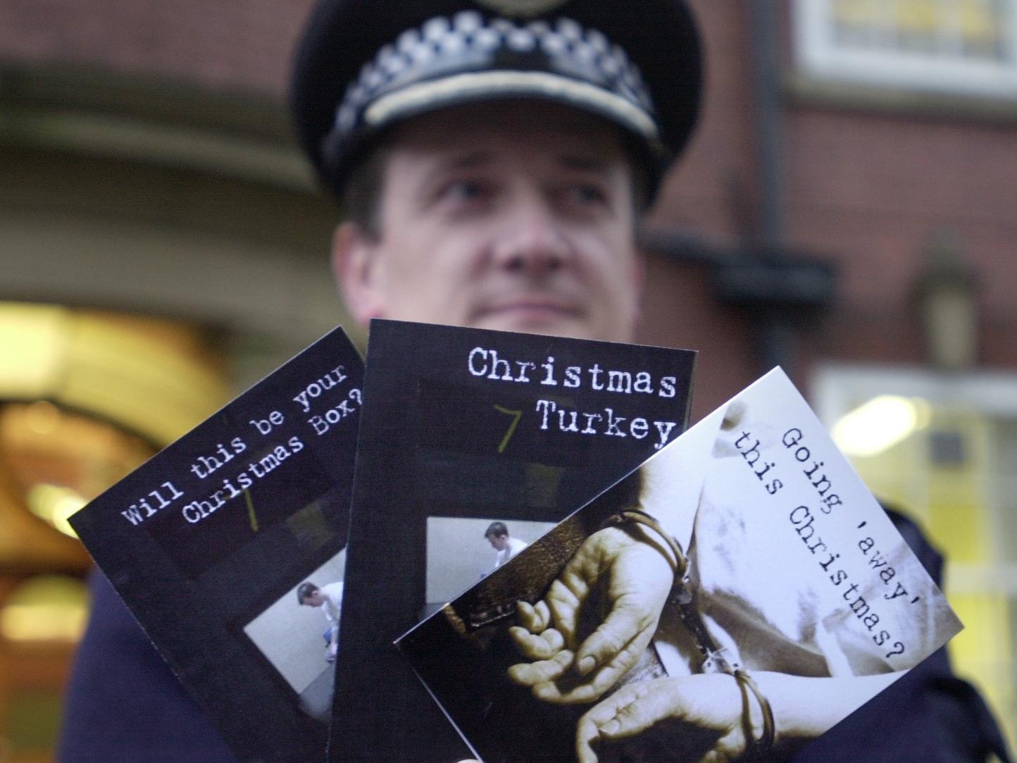 Assistant Chief Constable Grahame Maxwell holds a selection of Christmas cards to be sent to criminals from Wakefield Police HQ.