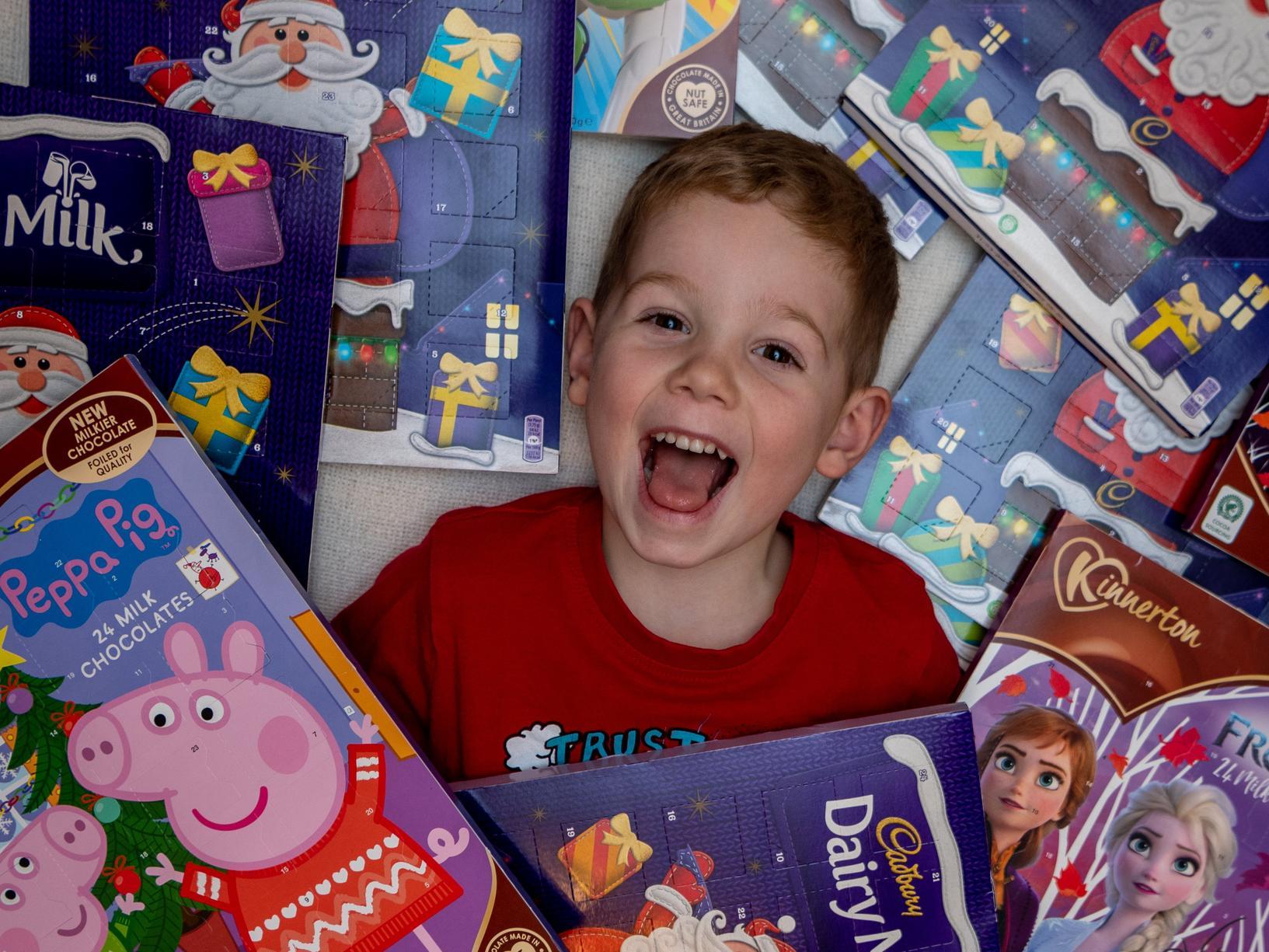Finley Chapman with some of the advent calendars people have donated for Leeds Children's Hospital.
Photo: James Hardisty.