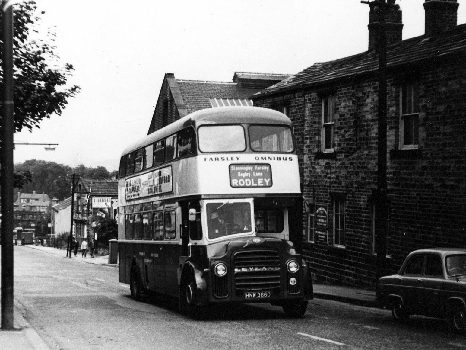 A view of a Farsley omnibus travelling along Richardshaw Lane, close to the Farsley Omnibus Garage. The railway viaduct at Stanningley Bottom can just be seen in the background. Taken between 1966 and 1969.