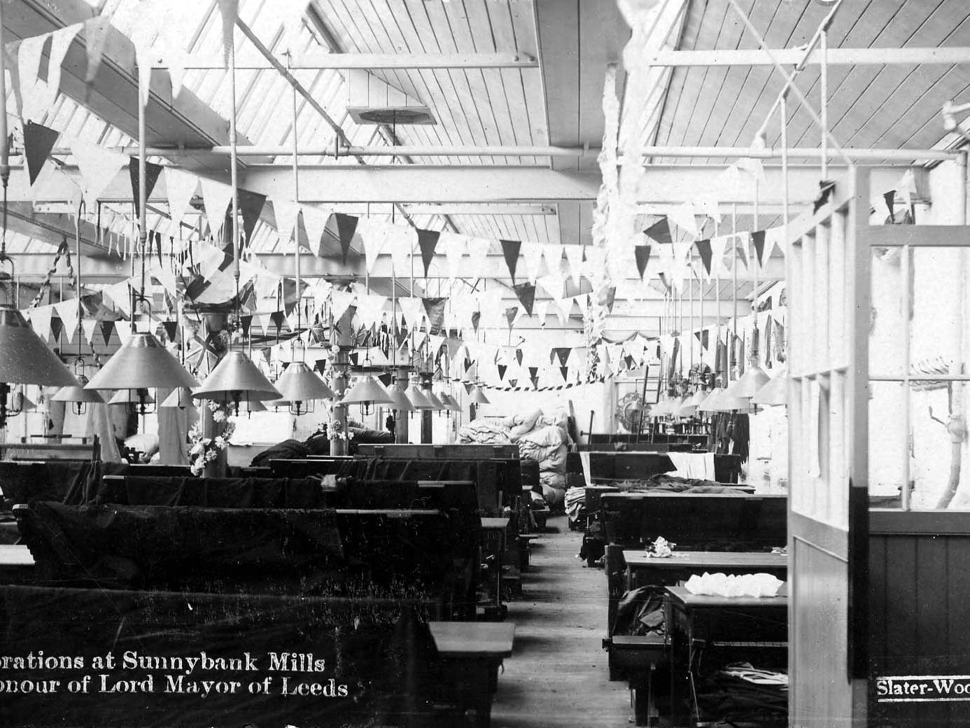 Inside Sunnybank Mills on Town Street, showing decorations in celebration of their owner Edwin Woodhouse being made Lord Mayor of Leeds in 1905.