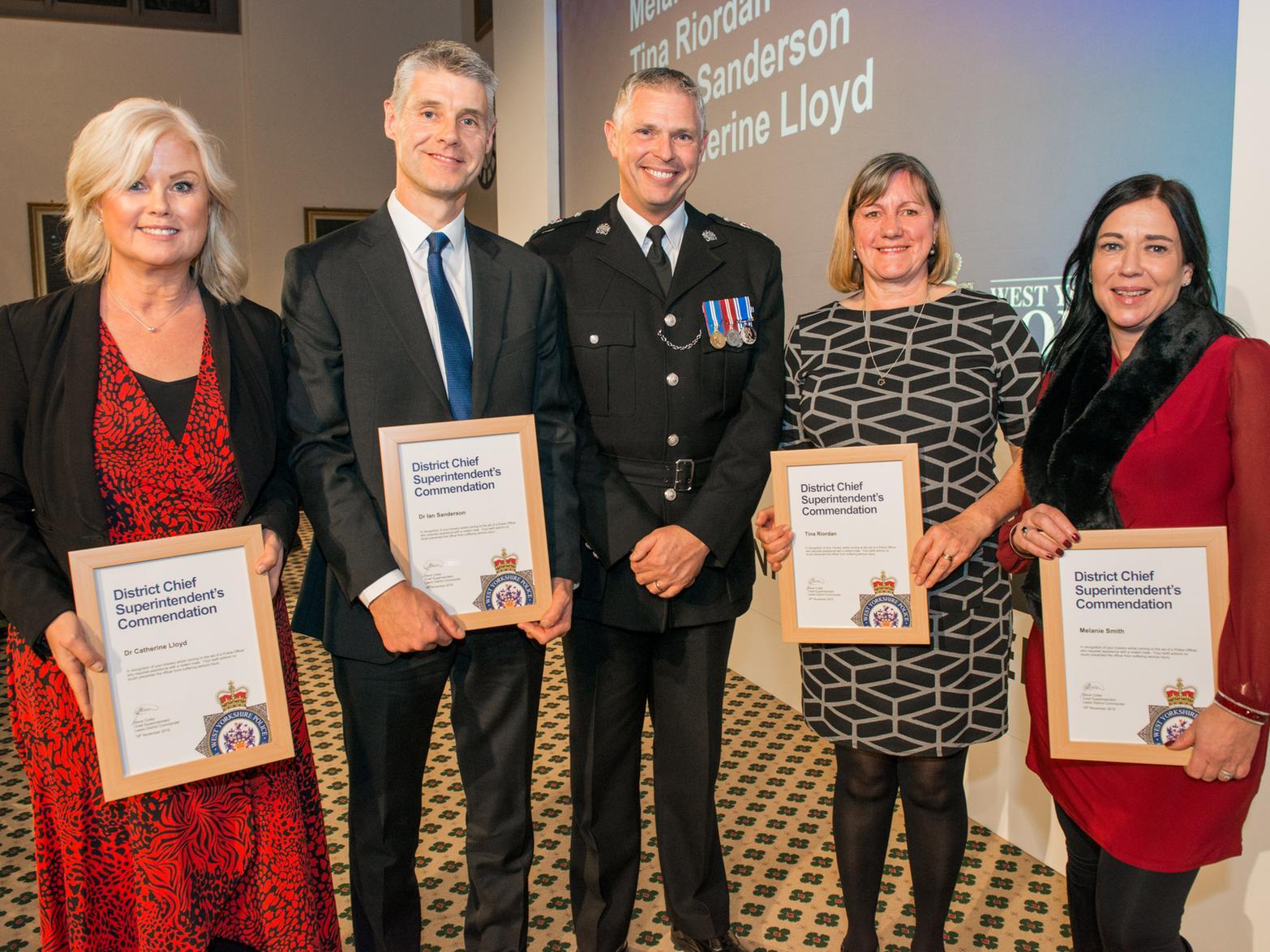 Dr Catherine Lloyd, Dr Ian Sanderson, Nurse Tina Riordan and member of the public Melanie Smith, receive their District Chief Superintendent's Commendations from Chief Supt Steve Cotter, of West Yorkshire Police.