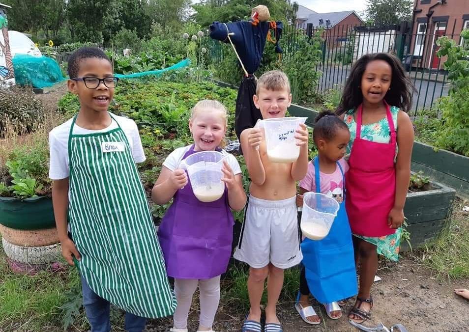 Children enjoying a session on an allotment with Hyde Park Source.