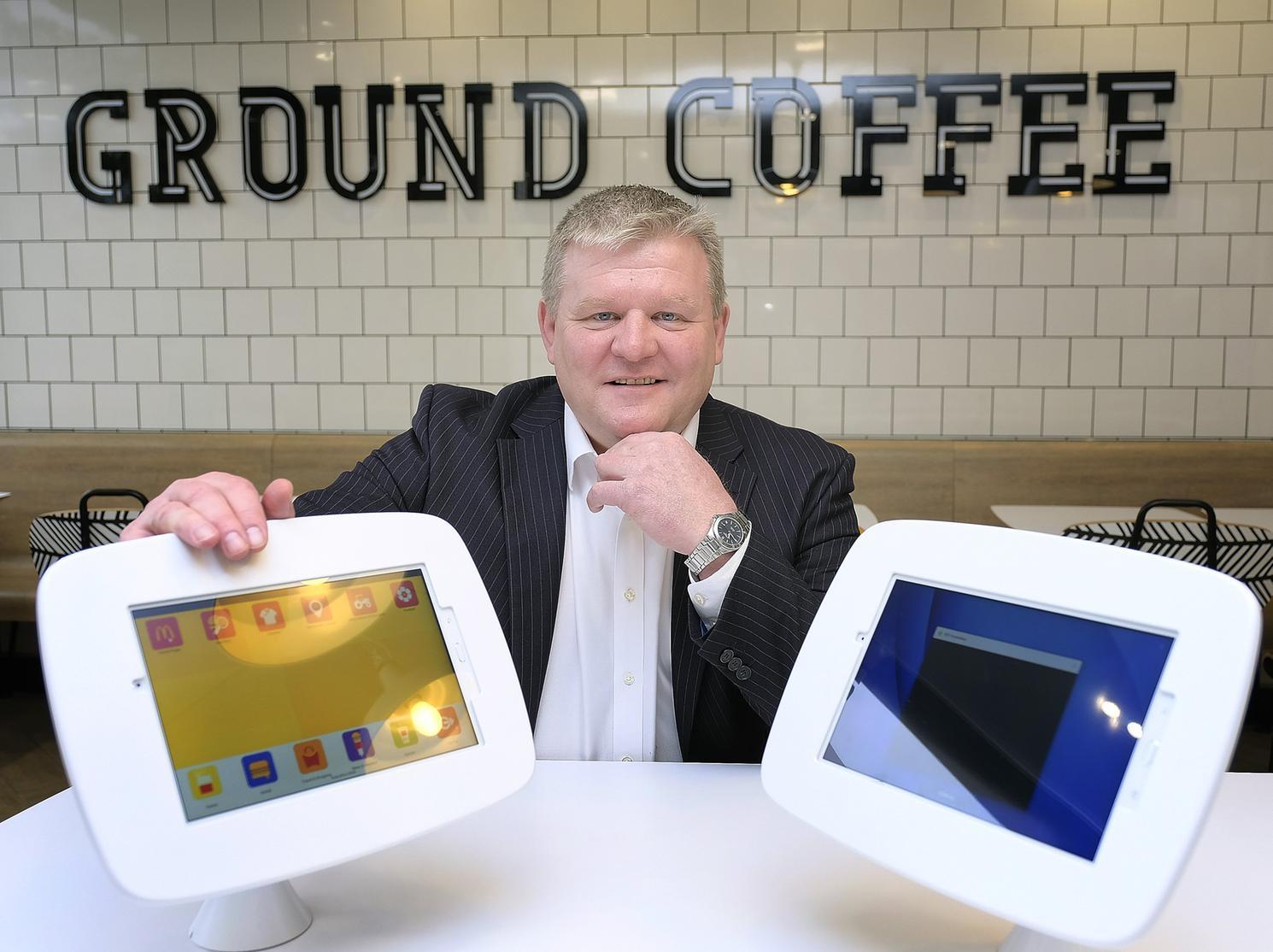 Franchise owner Richard Marcroft shows off the free to use tablets for children.