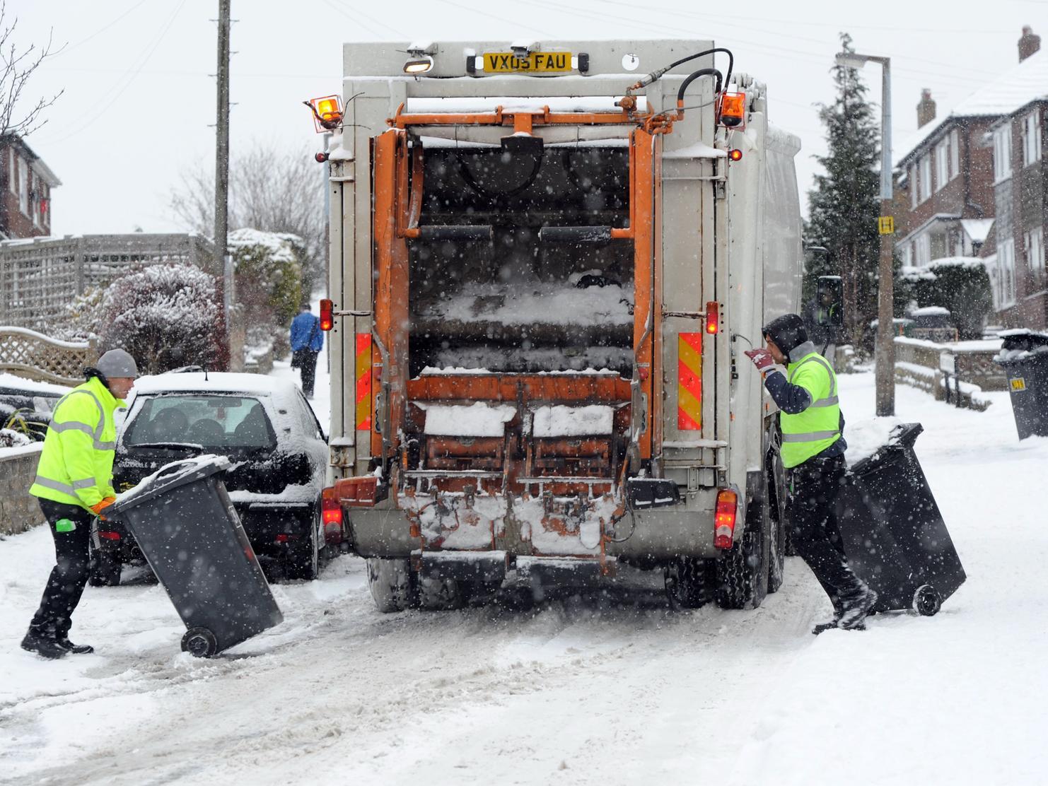 Bin men get their work done despite the snow covered roads in Mirfield.