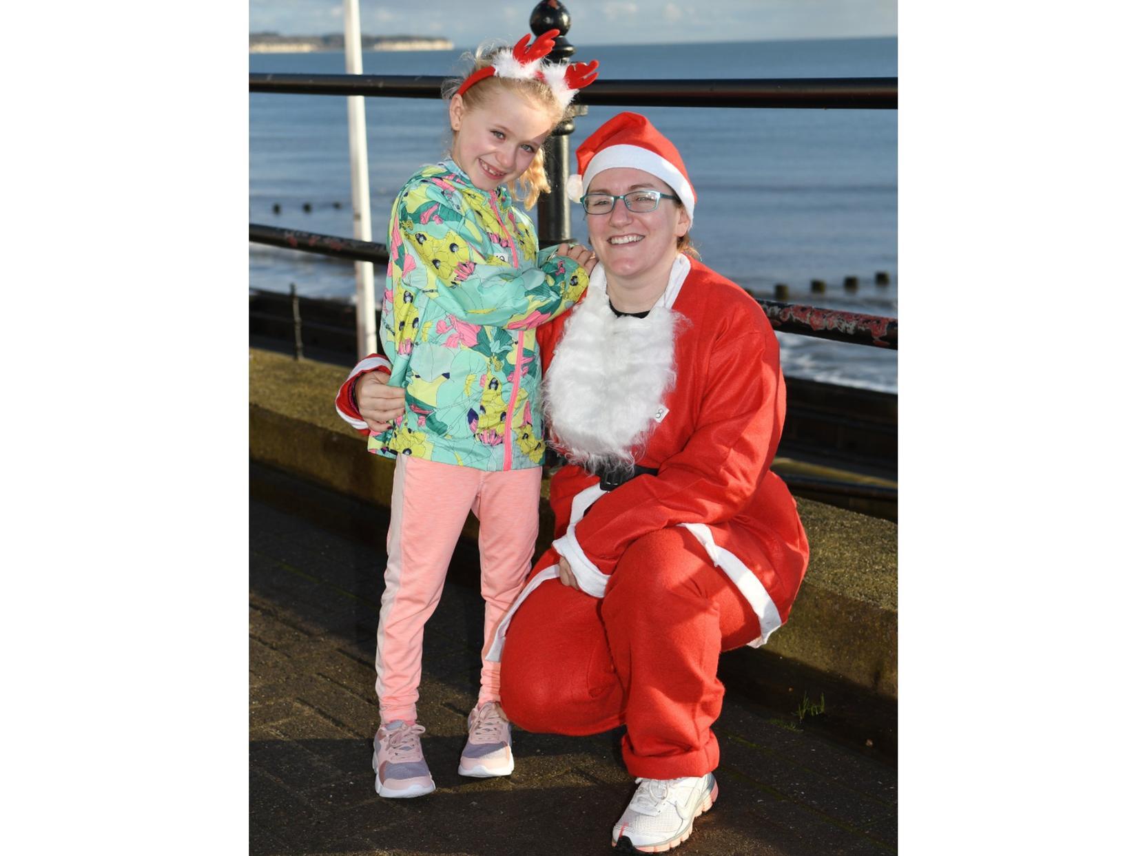 A santa and a reindeer, Isabel Wilson, 7, and Anne-Marie Wilson.