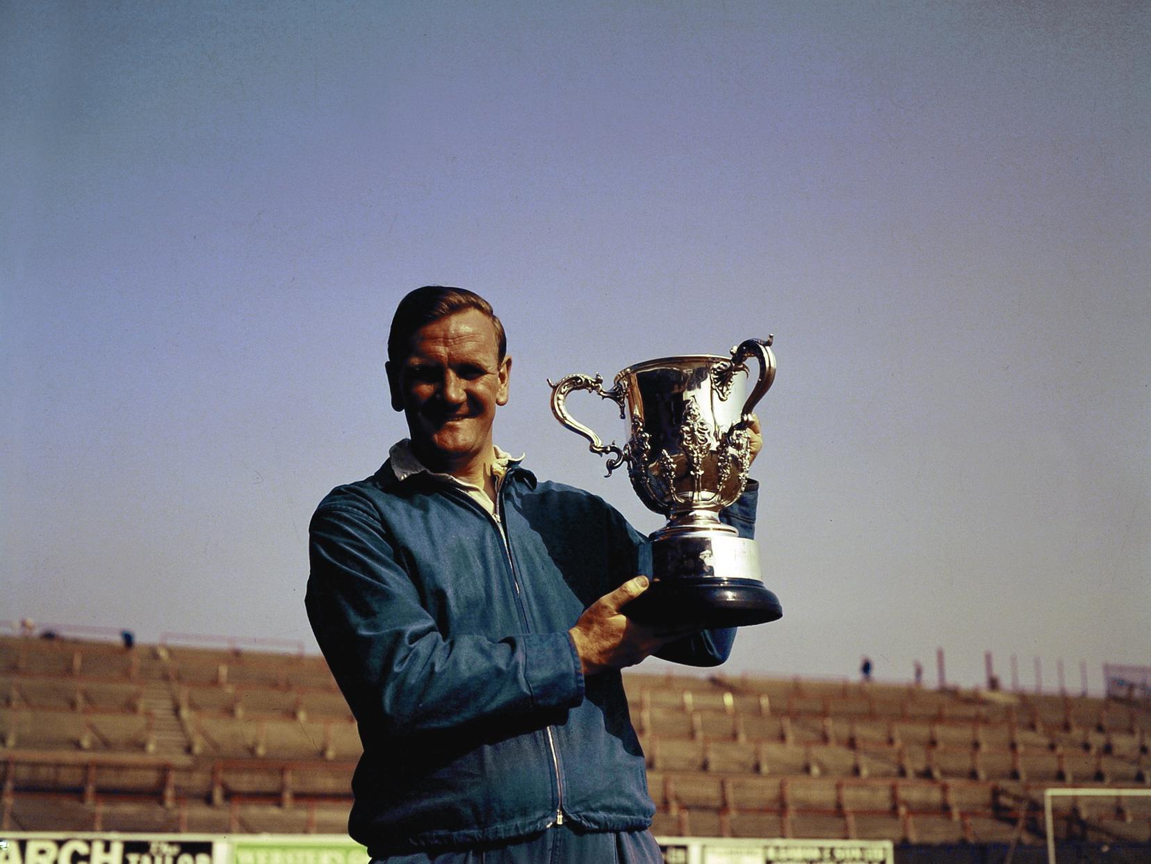 Don Revie holding the League Cup - his first major trophy as Leeds manager.