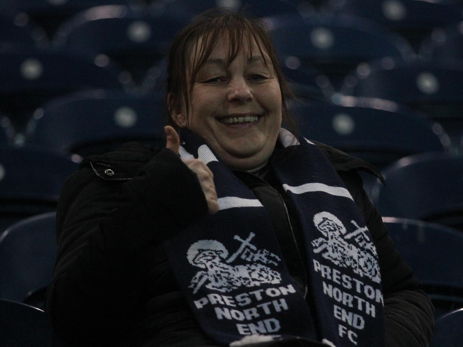 This fan is smiling ahead of the game, wearing a scarf from the original 'scarf game' back in May 2007.