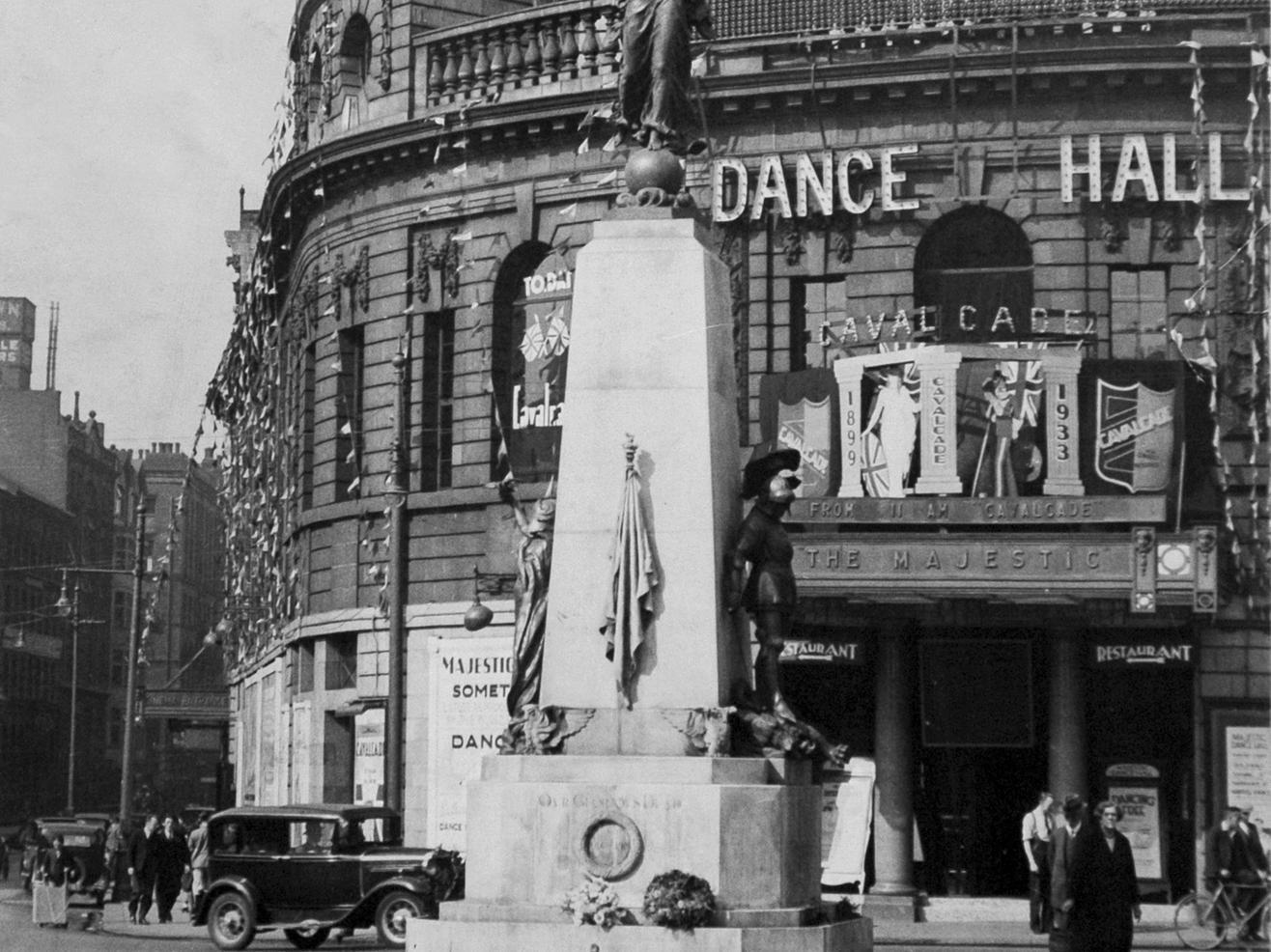 Pictured is the Leeds War memorial as it stood prior to it's move to The Headrow early in 1937. In the background is the Majestic Dance Hall.