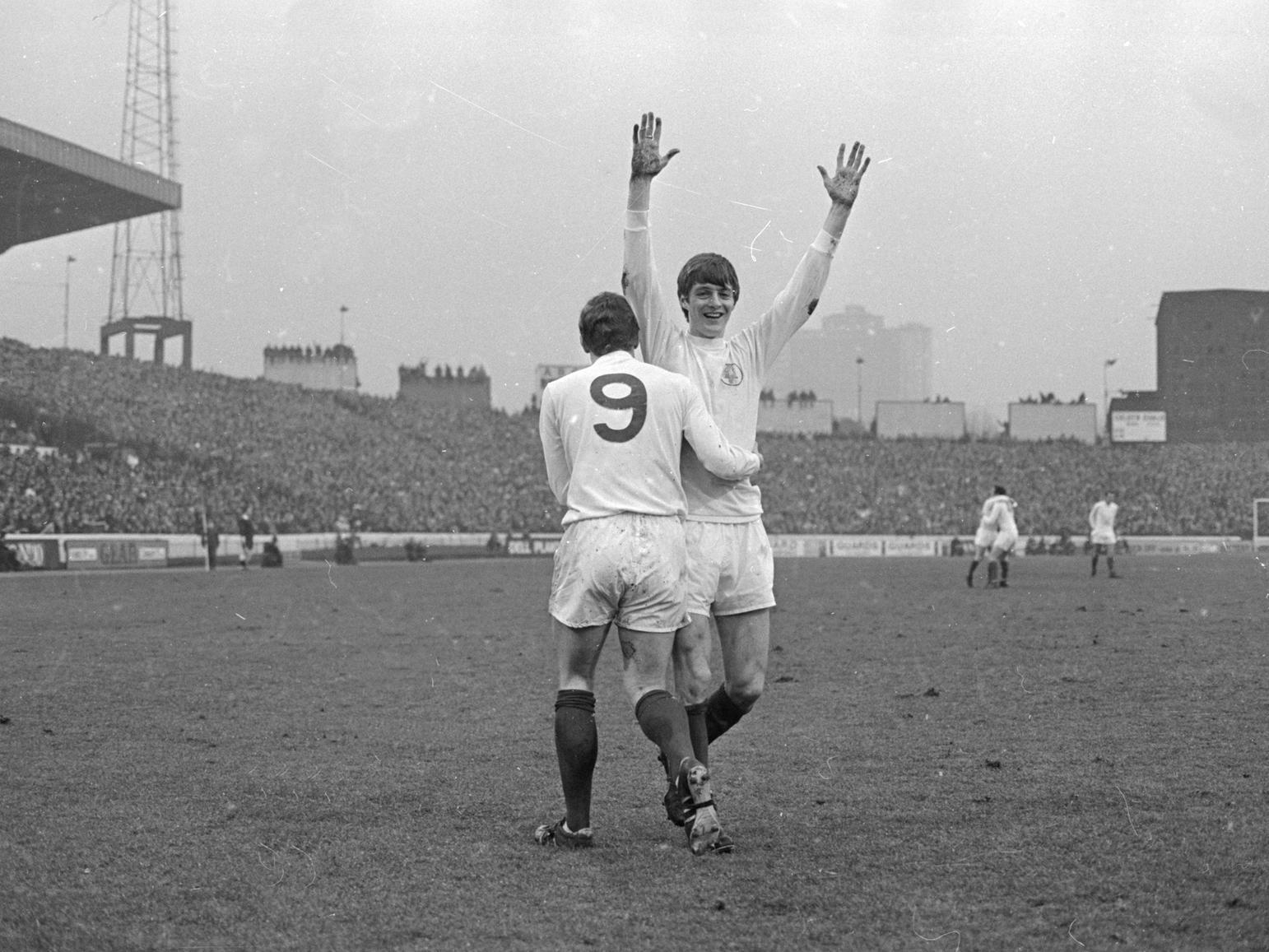 Mick Jones congratulates Allan Clarke after his goal gave Leeds United the lead in the First Division match at Stamford Bridge.