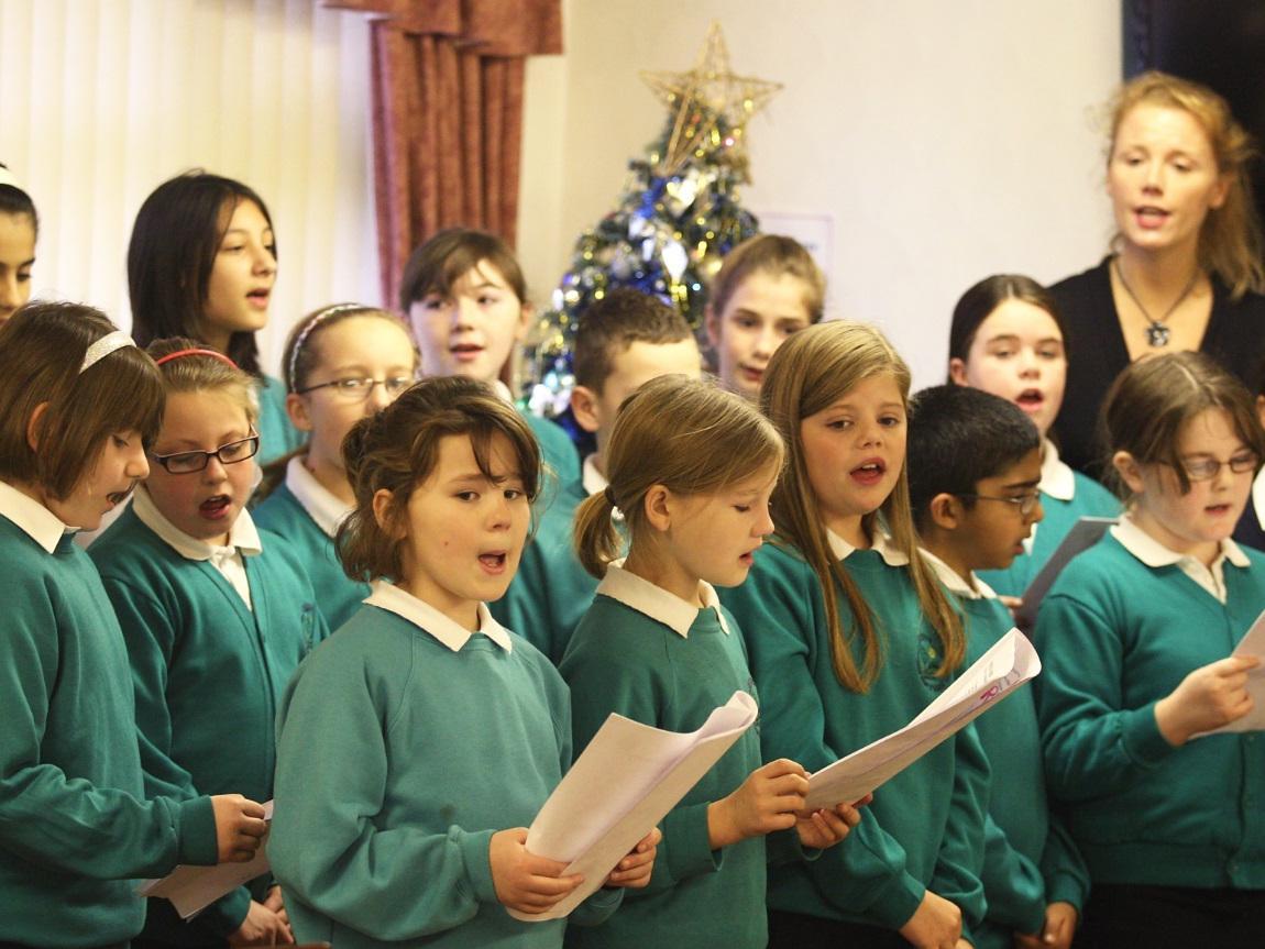 The choir from Greenhill J&I performing a Christmas concert for Sheltered housing folk in 2009.