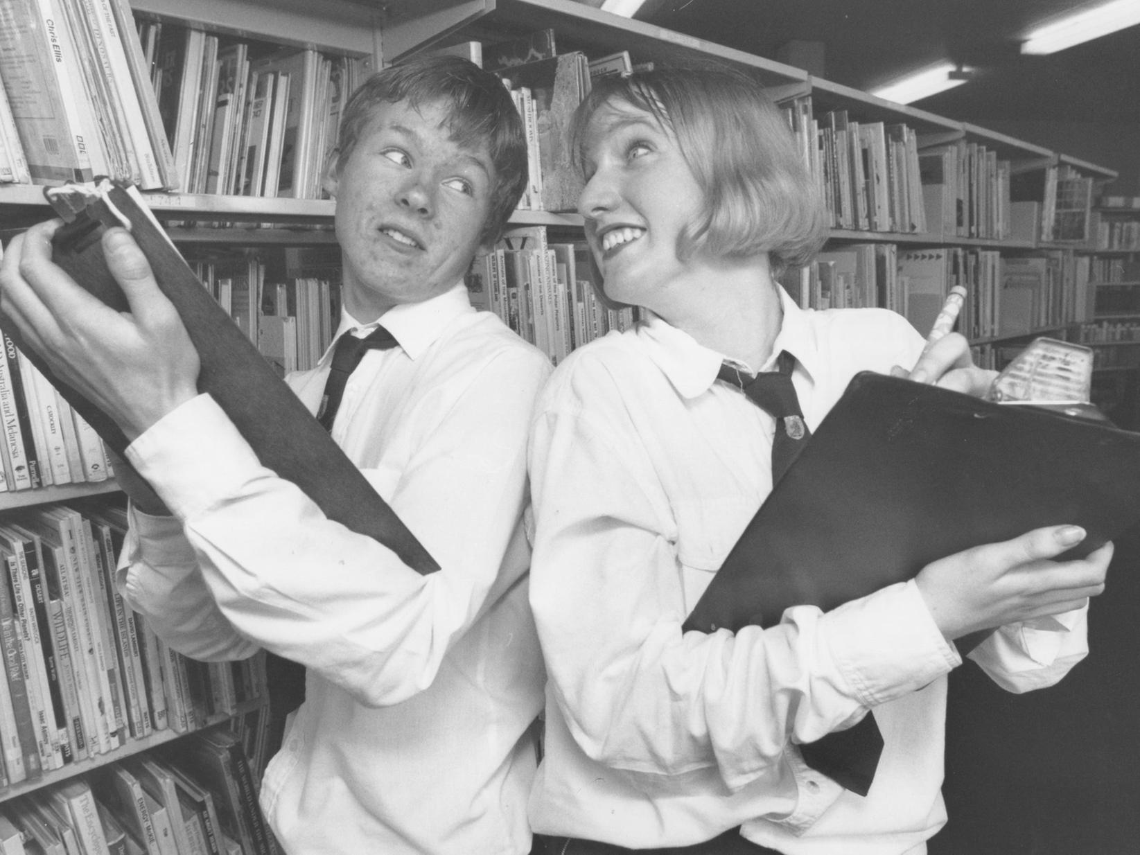 Pindar School pupils Andrew O'Neill and Jackie Hepples put their heads together to check their results following a recent project that involved interviewing prospective new teachers in March 1997.