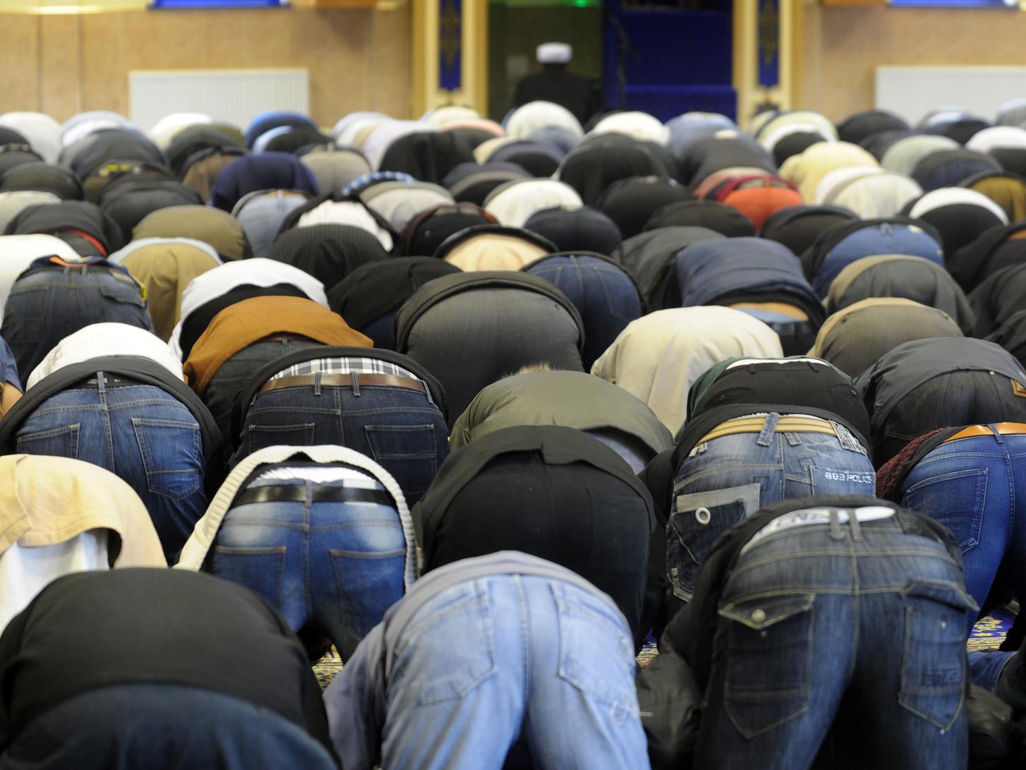 Worshippers at the Makkah Masjid Mosque, Burley, Leeds