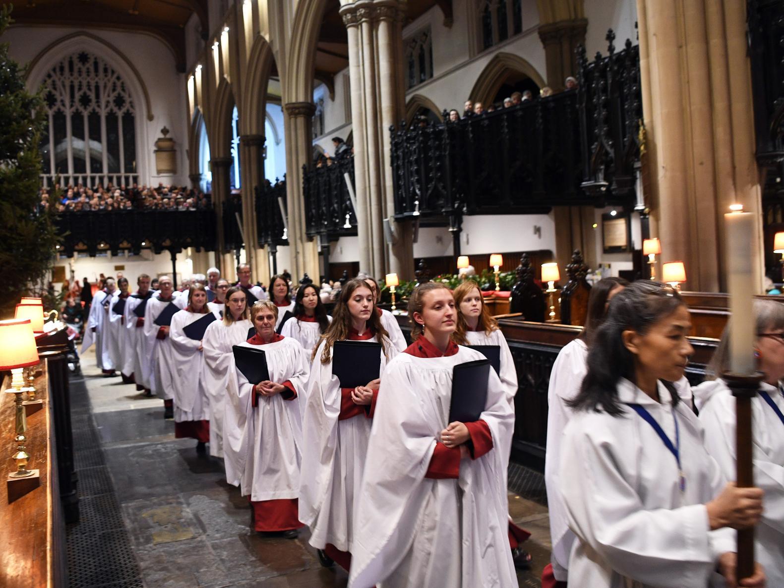 A procession signals the start of the service.