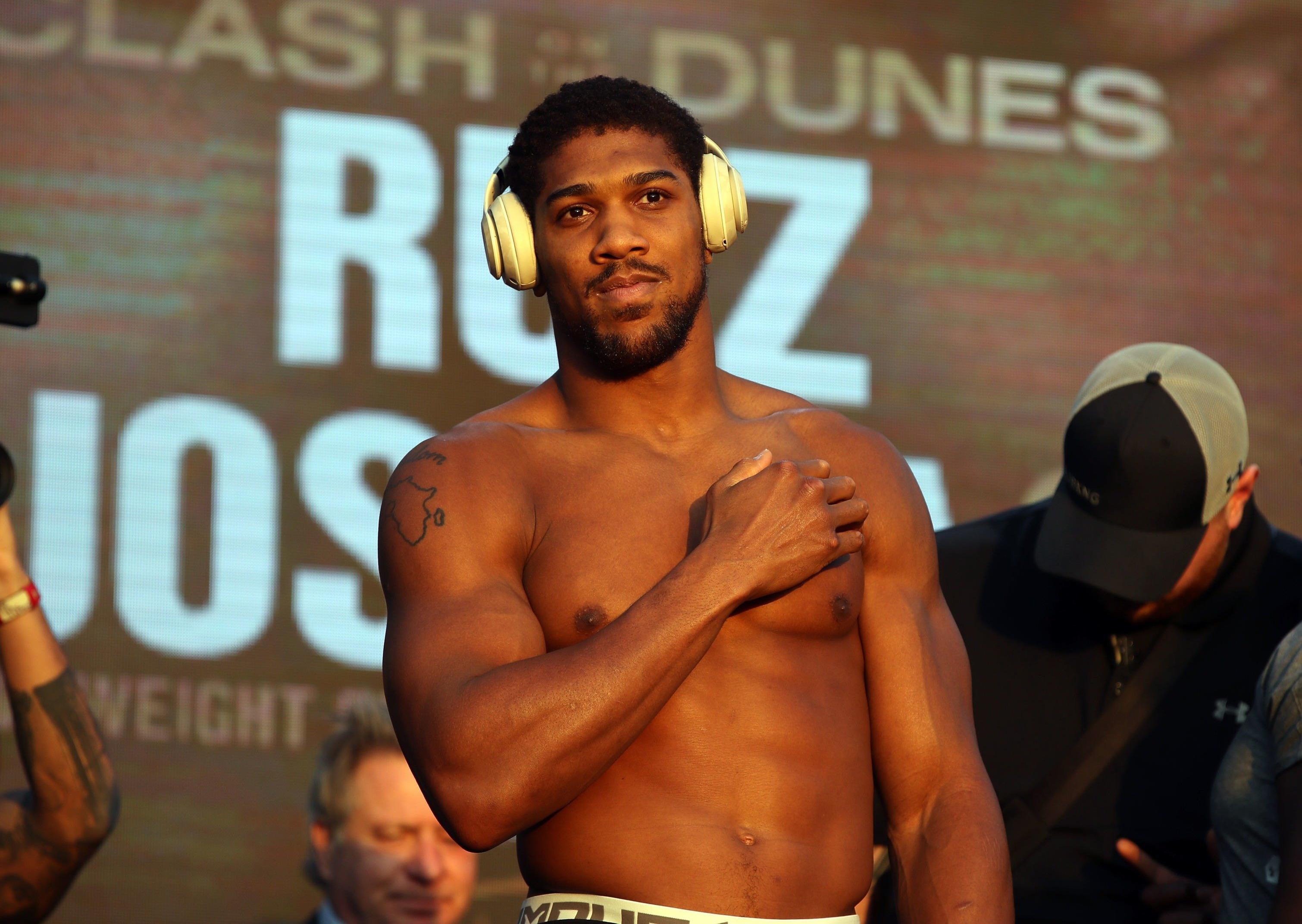 Anthony Joshua weighs in for his fight with Andy Ruiz Jr at the Al Faisaliah Hotel in Riyadh, Saudi Arabia eariler today.