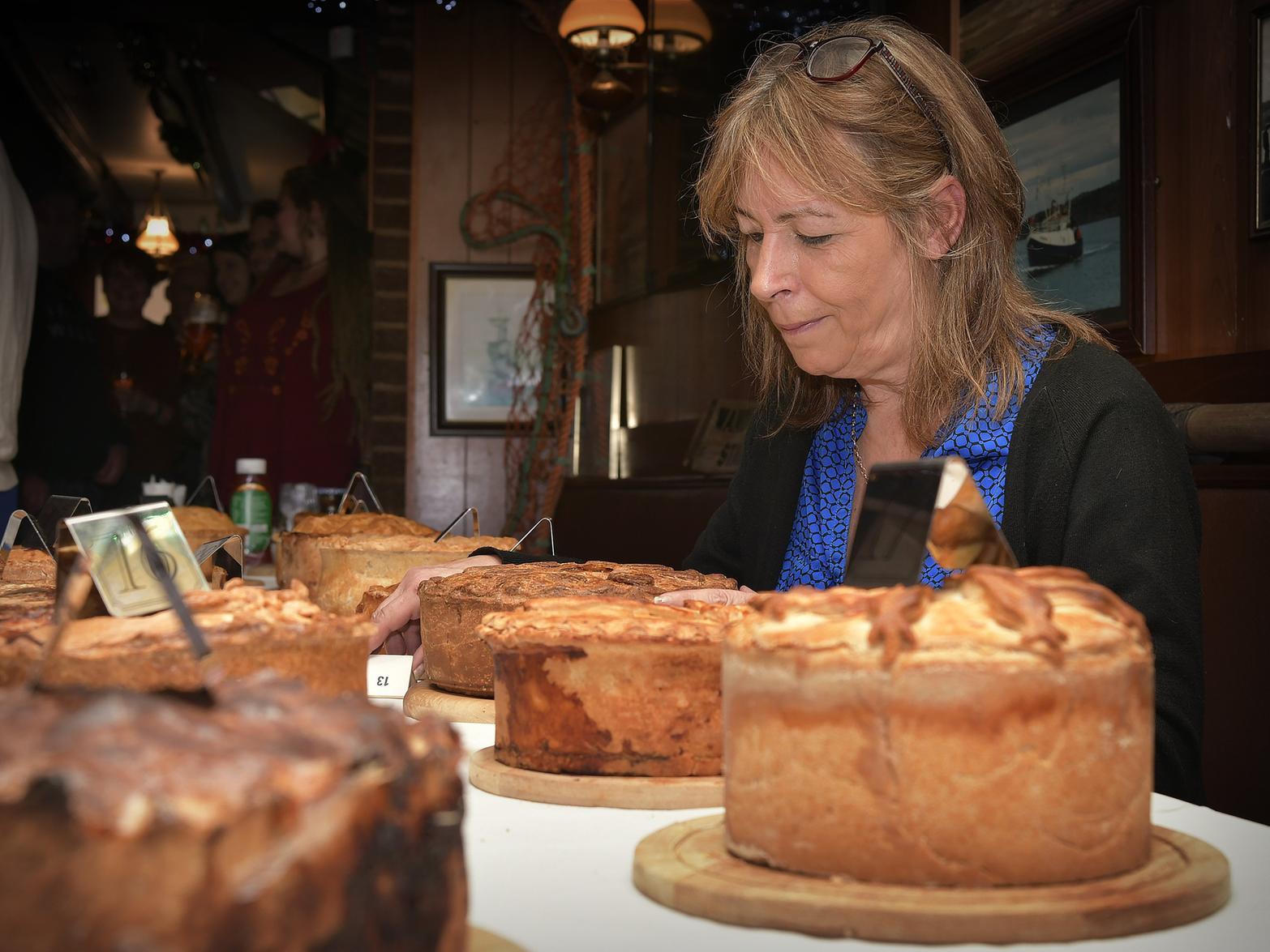 Landlady Marie Wood arranges the pies..