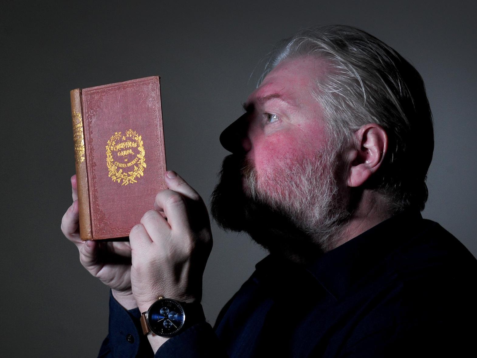 Richard High from the collections team at the Treasures of Brotherton Gallery looks at a first edition of A Christmas Carol, by Charles Dickens..10th December 2019.Picture by Simon Hulme