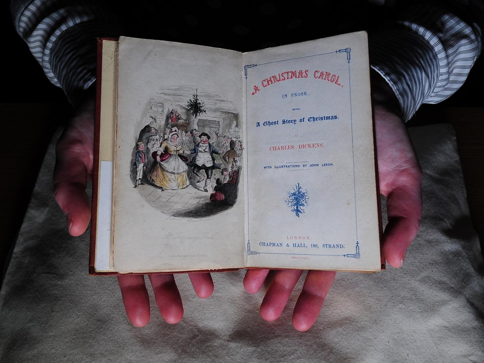 Richard High from the collections team at the Treasures of Brotherton Gallery pictured looking at items in the exhibition of Charles Dickens items.10th December 2019.Picture by Simon Hulme