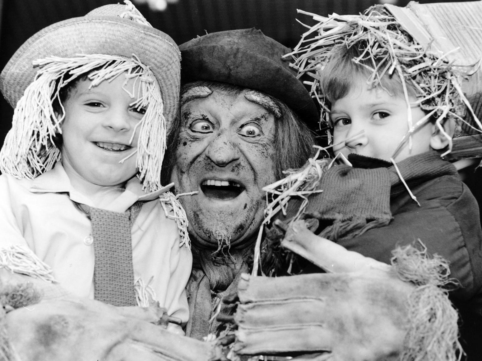 Actor and TV scarecrow Jon Pertwee is pictured at the Schofield Centre in Leeds with seven-year-old Wayne Kaeey and four-year-old Christopher Cunningham. The boys were winners of a Worzel Gummidge lookalike competition.