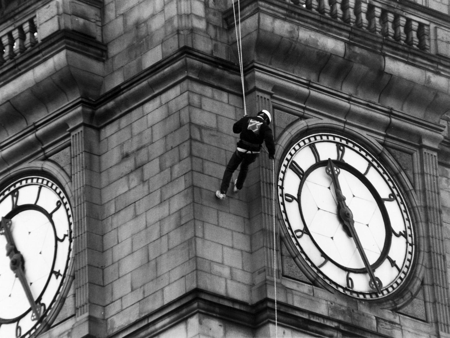 Simon Young abseils down Leeds Town Hall clock tower in November 1993, aiming to raise public awareness of local youth activity.