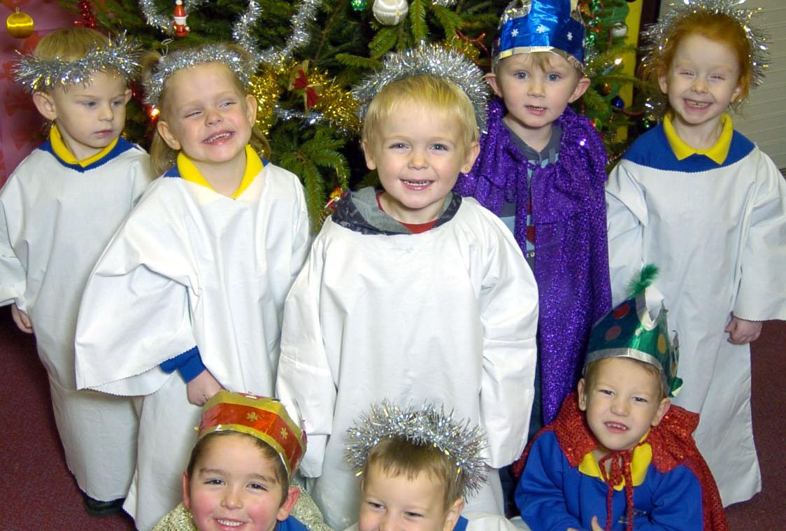 Nativity kids under the Christmas tree.