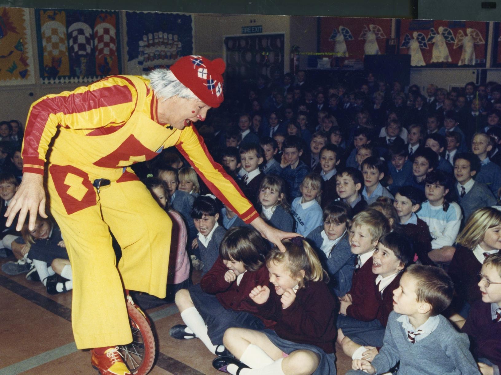 Clown Yuri provided festive entertainment for children at Charles Saer Primary School in December 1990
