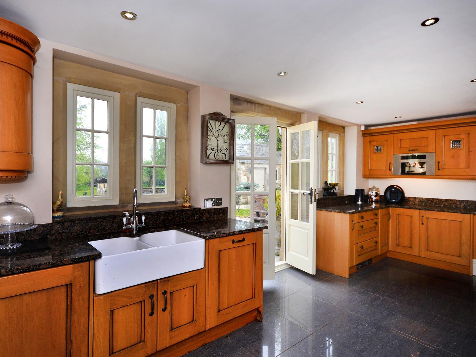 The large kitchen is next to a utility area to help cater for large numbers of people.