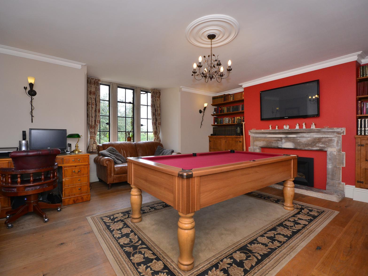 The house even has a room with a pool table.