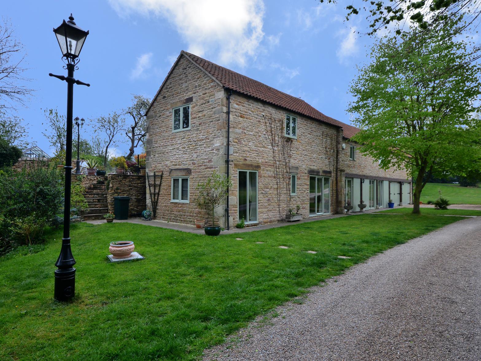 This three-bedroom stone cottage on the grounds of the manor was built in 2013.