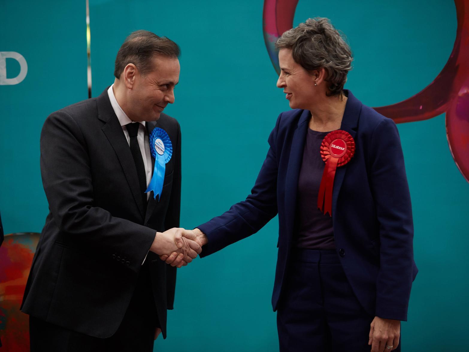 Ms Creagh shakes hands with the winning Conservative candidate, Imran Ahmad-Khan.