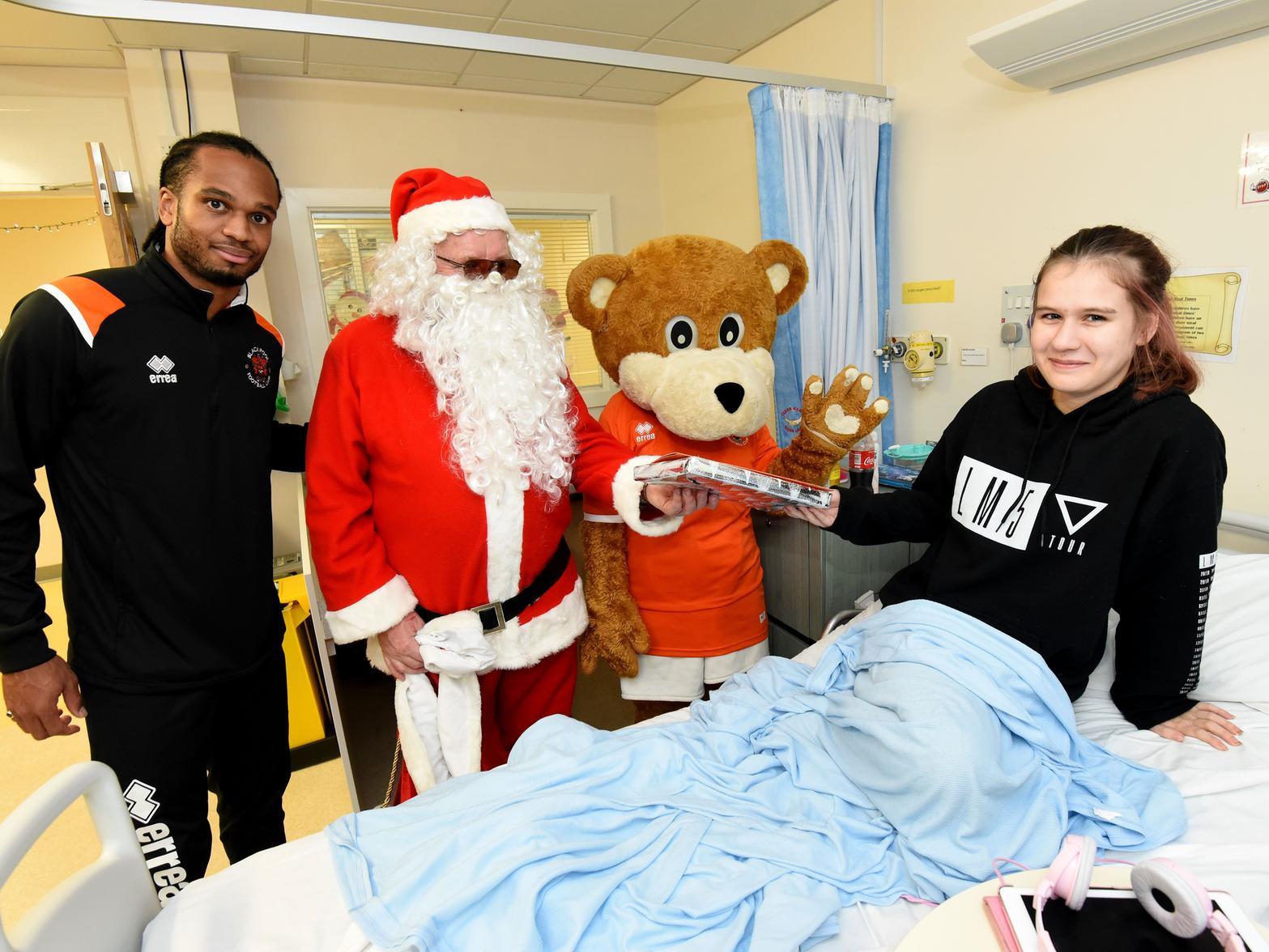Nathan Delfouneso with Father Christmas, Bloomfield Bear and 15-year-old Holly Clarke.