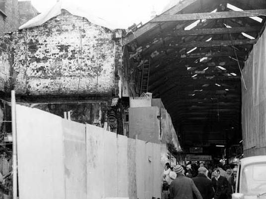 View of Kirkgate Market six days after two thirds of the building was destroyed by fire, showing the lower end of Game Row.