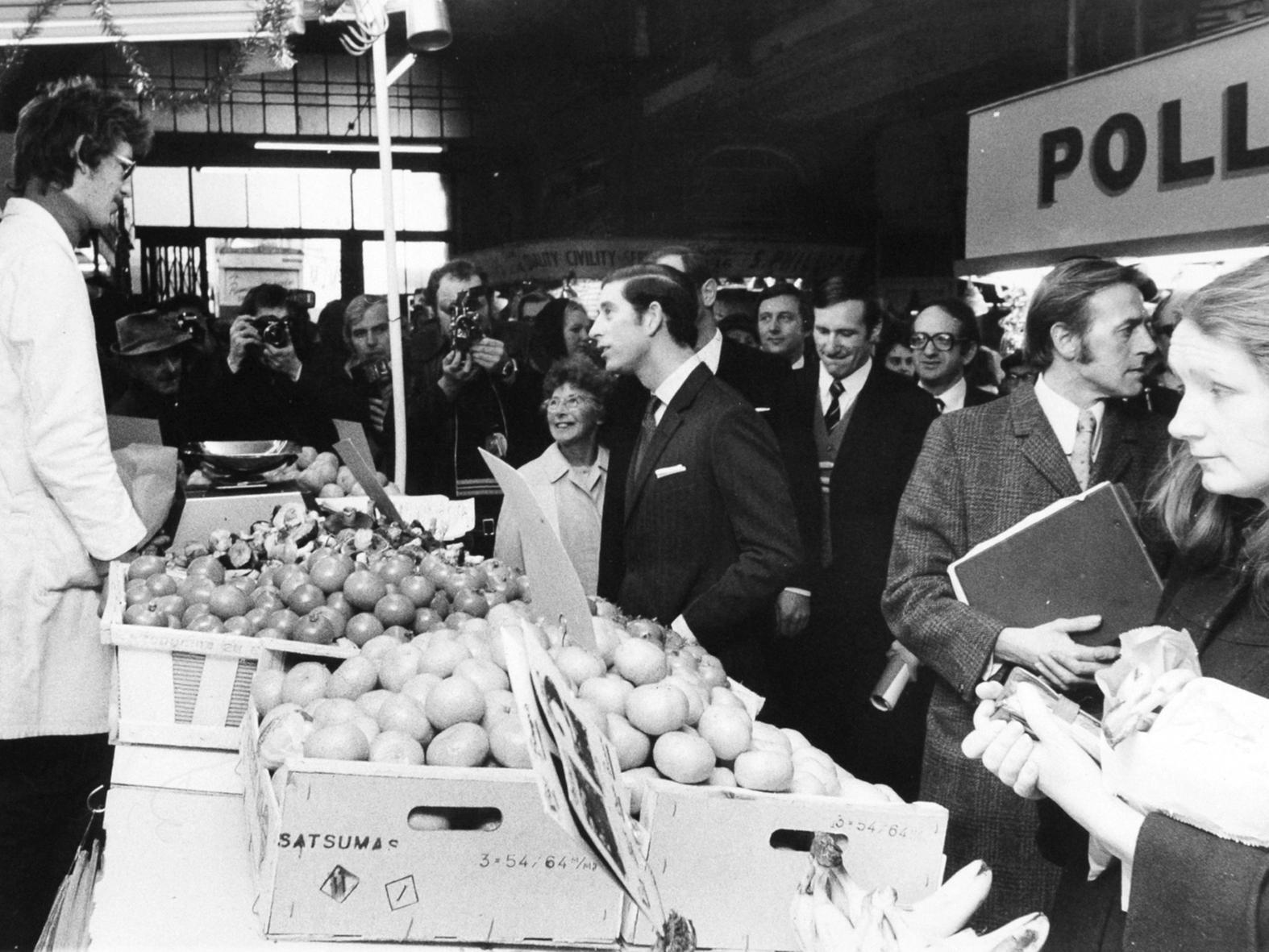 The fire prompted a visit from Prince Charles chats to a greengrocer in Kirkgate Market during his walkabout.