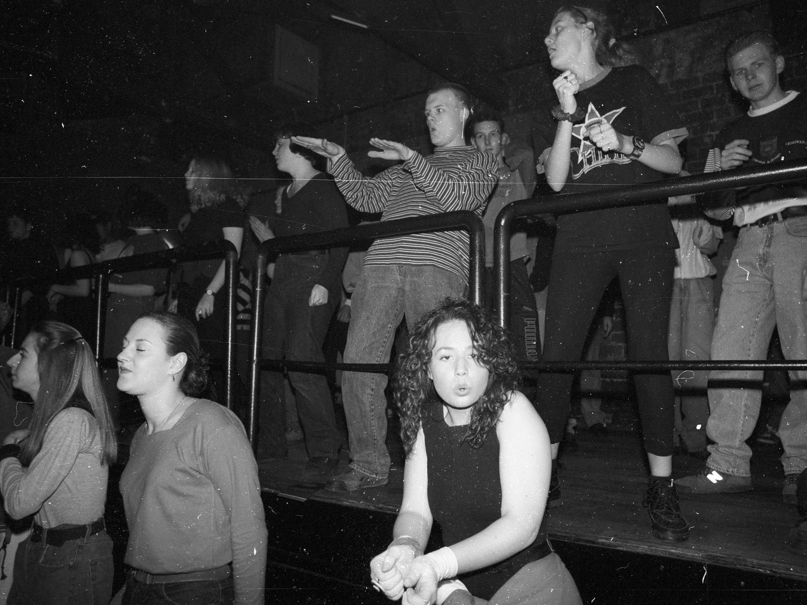 This reveller pouts for the camera as jeans dominated fashion.