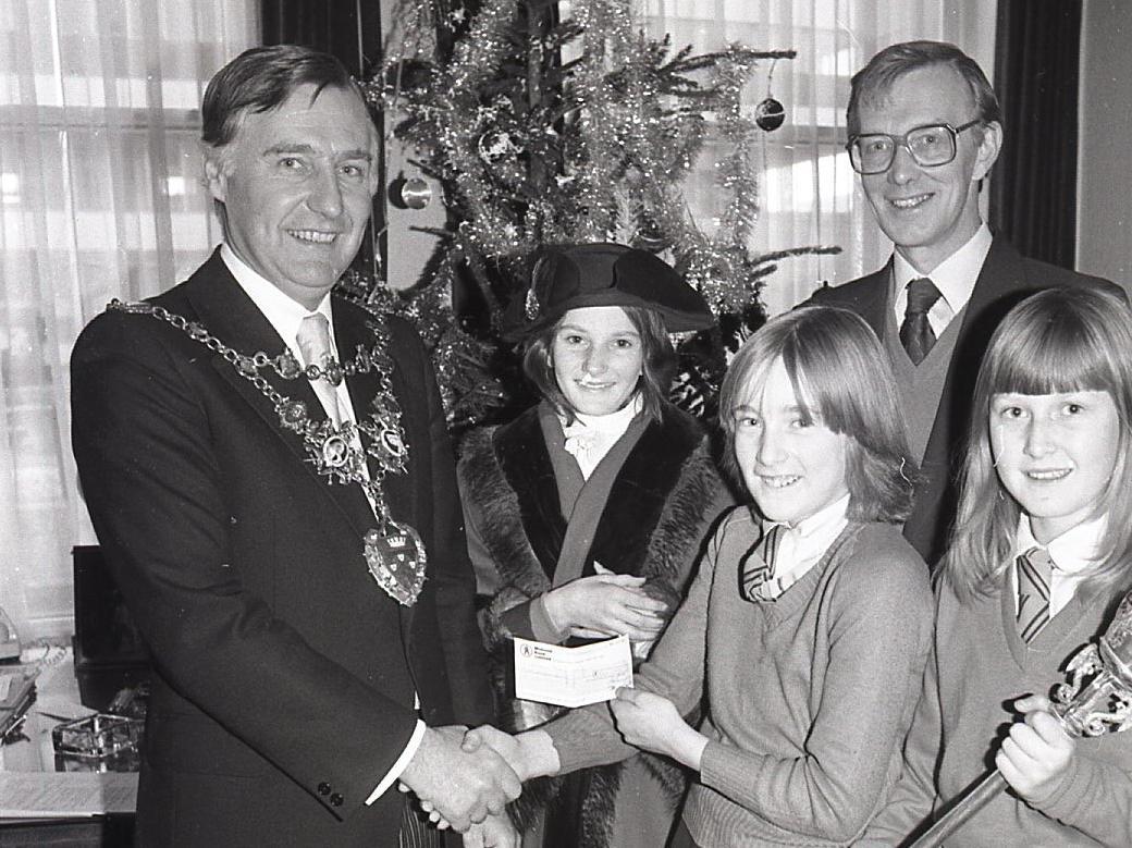 Three girls organised their own Christmas card postal service at St Albans High School, Chorley to help raise cash for the local mayor's charity, Children in Need... and it got the civic stamp of approval at a reception in Chorley town hall. Picture shows the mayor receiving the money from the girls (from left) Amanda Darbyshire, Amanda Daley and Lynne Derbyshire. Looking on is the school headmaster Mr Keith Banks
