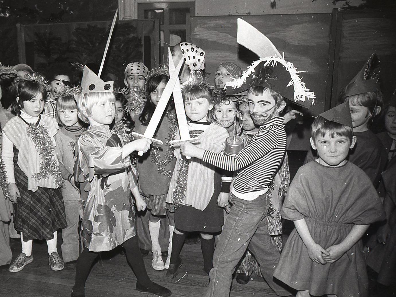 Peter Pan is 75 this year. And to commemorate the occasion, St Matthew's Infant school, Preston put on Peter Pan as its Christmas pantomime. In this picture, Peter Pan - George Nimmo, six, of Nevett Street, Preston - is seen in combat with his arch-enemy Captain Hook, played by six-year-old Mark Sloane, of Fishwick Parade, Preston