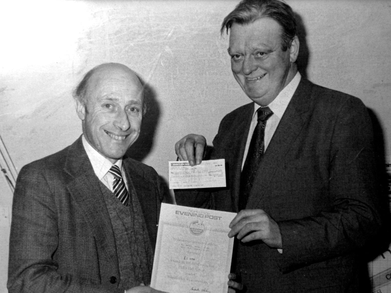 Dr Martin Berger with the then YEP editor Malcolm Barker  being presented a certificate for his efforts for the Half and Half through his two pictures of Adel Church.